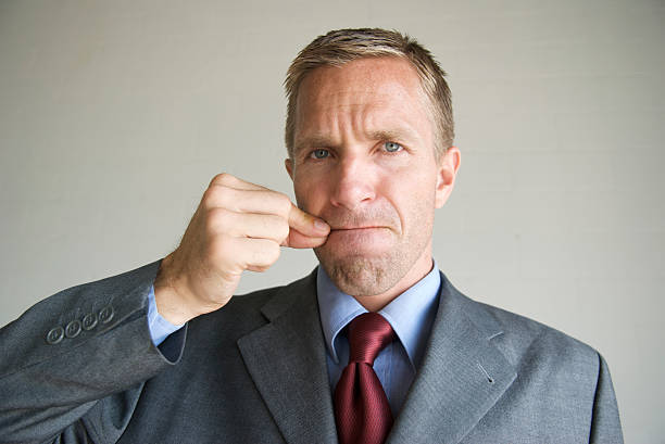 Businessman Office Worker Zips His Mouth to Keep Secret stock photo