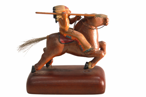 Side view of statue of Native American Indian in headgear with spear riding a horse.YOU MIGHT ALSO LIKE THESE INTERESTING OBJECTS