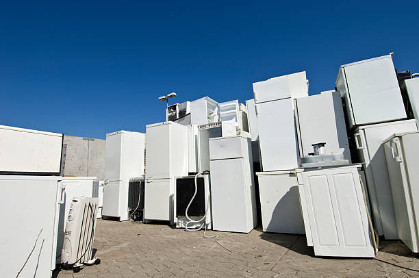 Old Refrigerators Waiting to Be  Scrapped At a Recycling Center stock photo