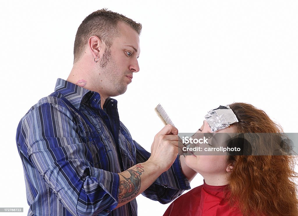 Make Over - Isolated Hairdresser coloring a female customer's hair. 30-39 Years Stock Photo