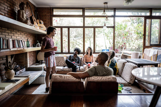istock Young man playing guessing game with friends at home 1727889659