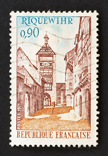 Riquewihr is a village and commune in Alsace in France with interesting historical architecture. Stamp from year 1971.This and other images in