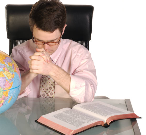 istock Pastor Praying For The World 172790317