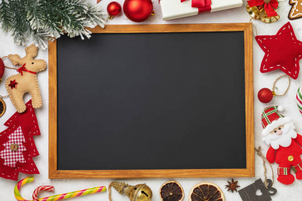 istock Chalk board surrounded by various Christmas accessories with copy space, template for designer 1727904971