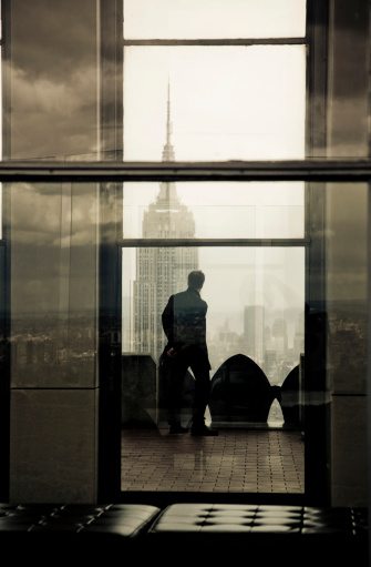 man looking to empire state building.Silhouette Lightbox
