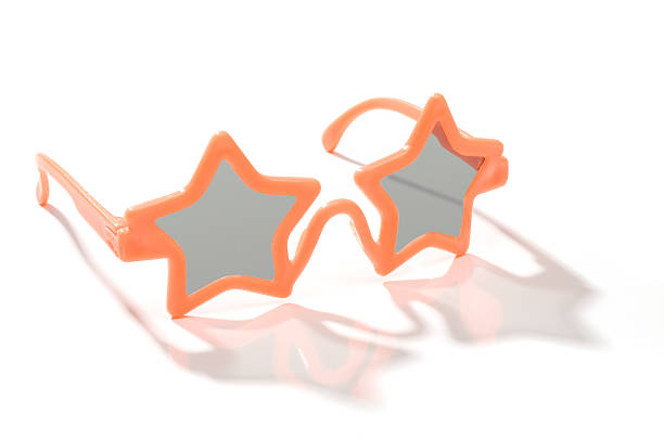 istock Child's orange star shaped sunglasses-isolated on white 172791848
