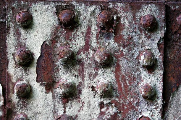 istock Rusted green rivets in corroded steel 172792281