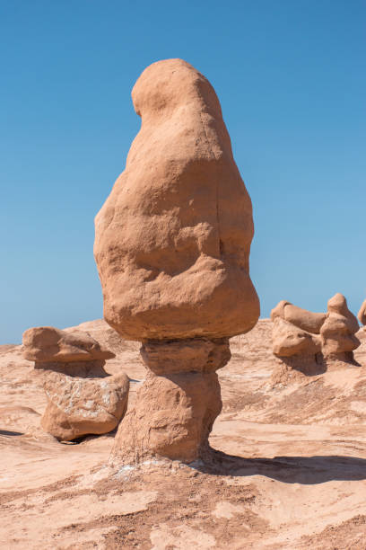 istock Desert Landscape with Eroded Rock Formations and Clear Blue Sky 1727924227