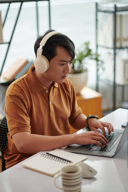 istock Tester Listening to Music when Working 1727927591