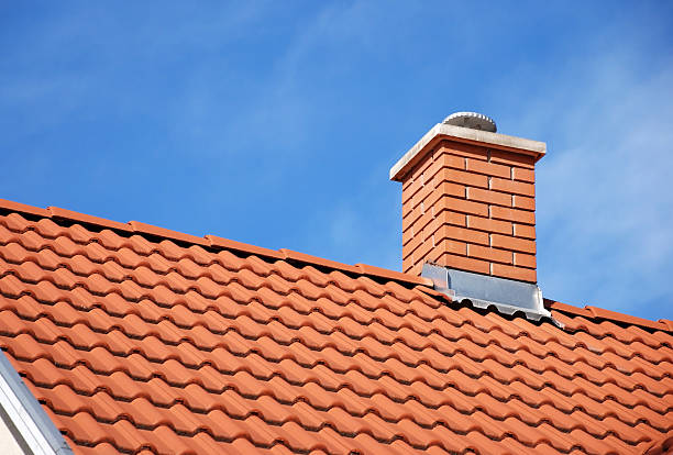 smoke stack and roof smoke stack on the tiled roof of a family house red brick tile stock pictures, royalty-free photos & images