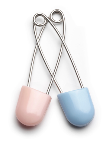 Pink and blue baby safety pins