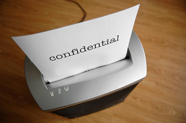 istock Paper shredder destroys confidential information 172793175
