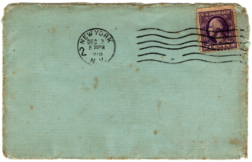 A dirty blue envelope posted in New York in 1918.