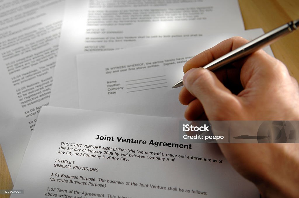 Accordo di joint-venture - Foto stock royalty-free di Accordo d'intesa