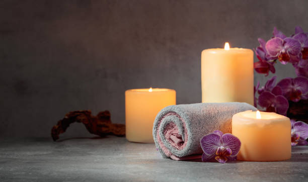 istock Towels, orchid flowers, and burning candles. 1727943225