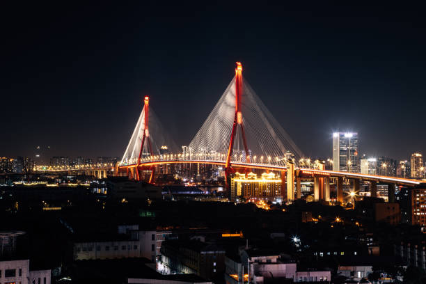 istock Yangpu Bridge, Yangpu District, Shanghai - low angle view of the illuminated bridge at night 1727944371