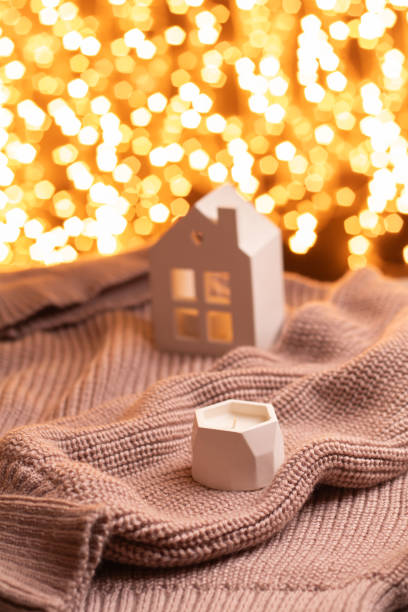 istock photo sweater candle Christmas lights. 1727945139