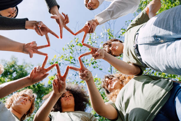 istock Volunteers making a star shape with their hands 1727947683