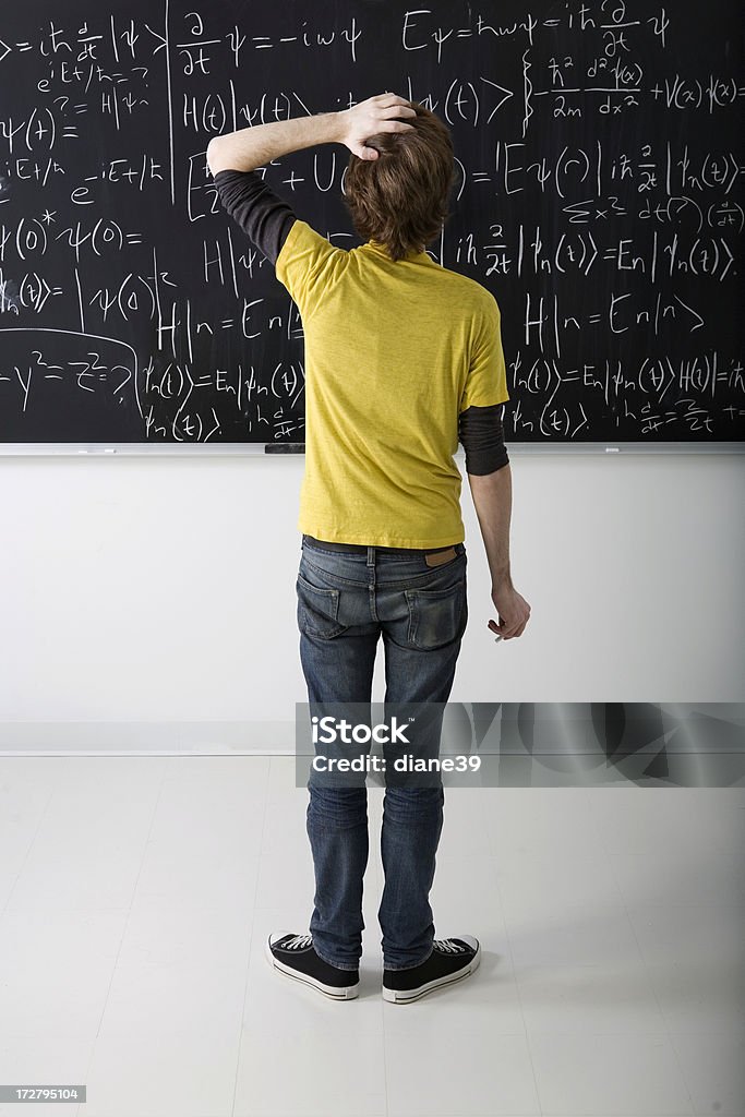 Student Looking At Math Boy Looking At Math Problem On Blackboard Stock Photo - Download Image ...