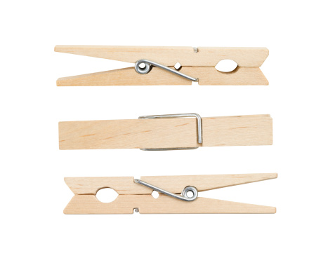 Three wooden clothespins, isolated on white, with clipping path.