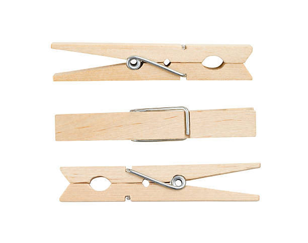 Three Wooden Clothespins Three wooden clothespins, isolated on white, with clipping path. clothespin wood stock pictures, royalty-free photos & images