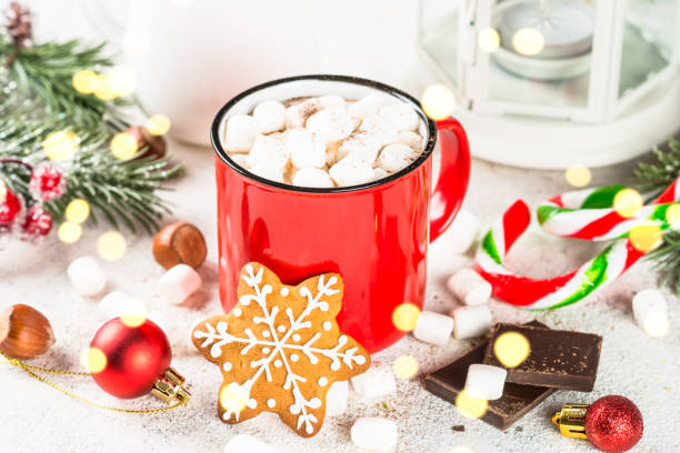 istock Hot chocolate with marshmallow and christmas cookies at white table. 1727953655
