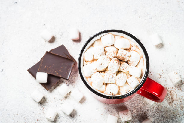 istock Hot chocolate with marshmallow and christmas cookies at white table. 1727954245
