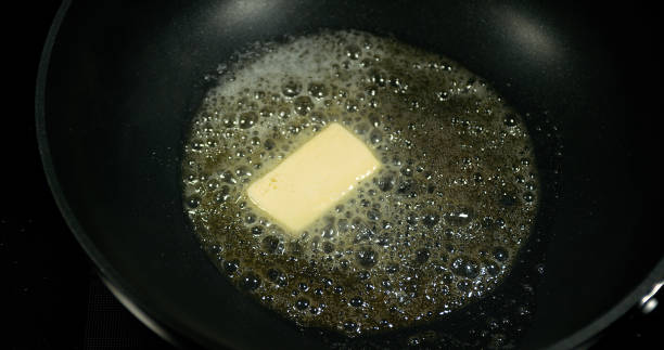 istock Butter that melts and crackles in a stove. 1727954829