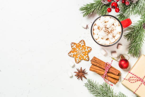 istock Hot chocolate and gingerbread cookies at white table. 1727955396