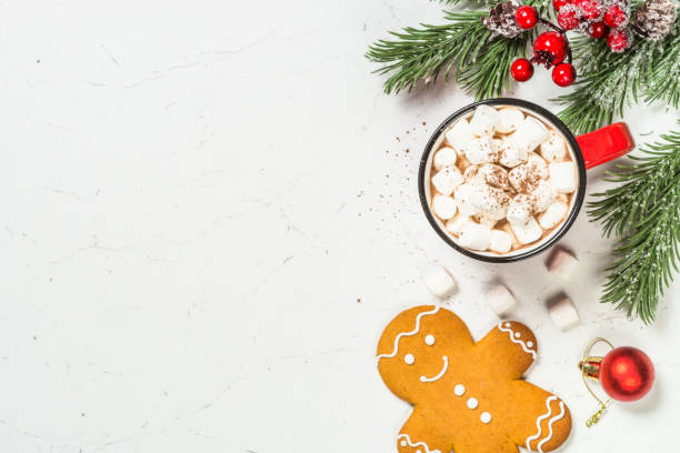 istock Hot chocolate and gingerbread cookies at white table. 1727957587