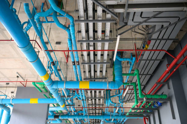 istock Open system pump pipeline building construction in parking at condominium 1727961432
