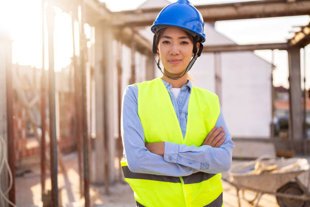 istock Portrait of a woman engineer, construction worker or an architect working at the construction site. 1727964197