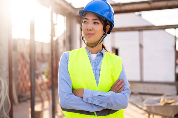 istock Portrait of a woman engineer, construction worker or an architect working at the construction site. 1727964198