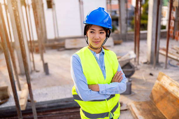 istock Portrait of a woman engineer, construction worker or an architect working at the construction site. 1727964741