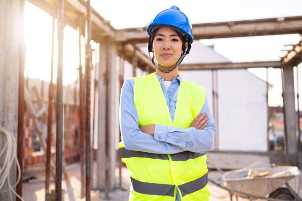 istock Portrait of a woman engineer, construction worker or an architect working at the construction site. 1727964751