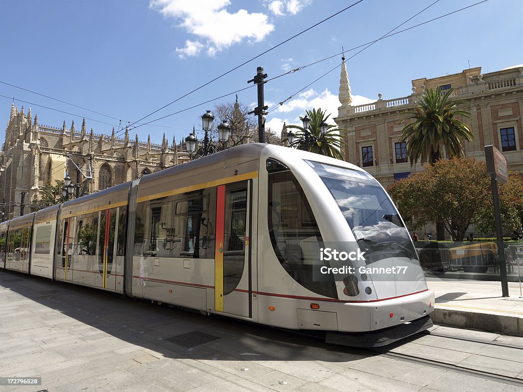 Modern Tram, Seville "A tram in Seville, Spain, with the Cathedral in the background.See my lightbox" Cable Car Stock Photo