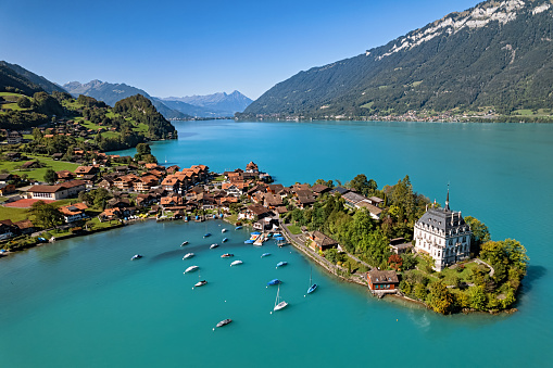 Aerial view of picturesque fishing village Iseltwald on Lake Brienz, Switzerland.