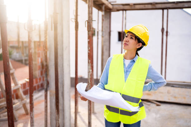 istock Woman engineer, construction worker or an architect working at the construction site. 1727967642