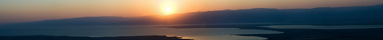 This is a composite of about 6 pictures from the top of Masada, Israel overlooking the Dead Sea.  The hot middle Eastern sun rises from the Syrian side.