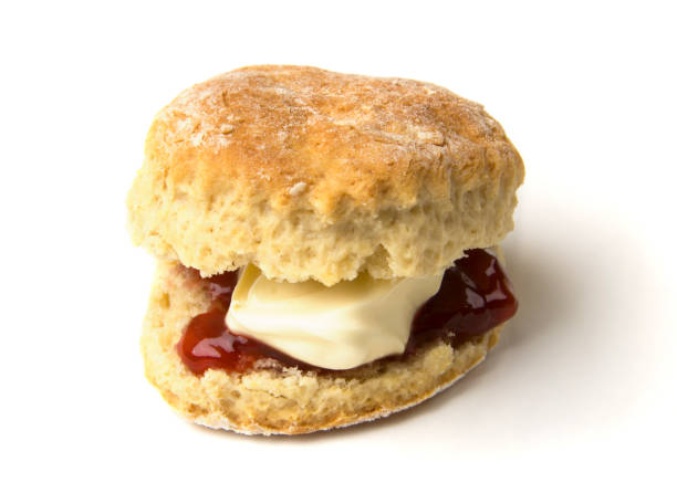 Scone with jam and clotted cream stock photo