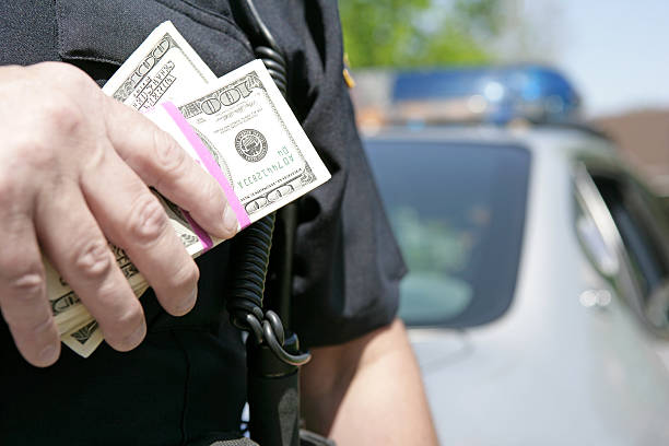 corrupção - police bribe - fotografias e filmes do acervo