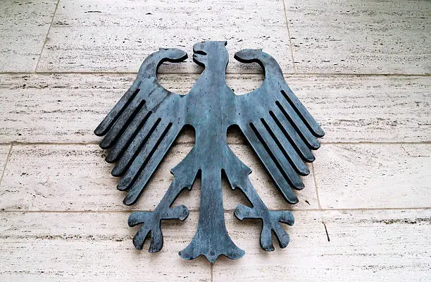 the imperial german eagle, national coat of arms germany, beside the entrance of the german department for foreign affairs, berlin, germany....