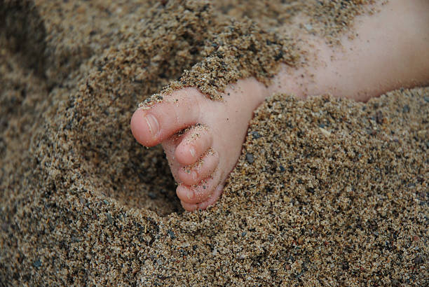 Baby in Sandbox stock photo