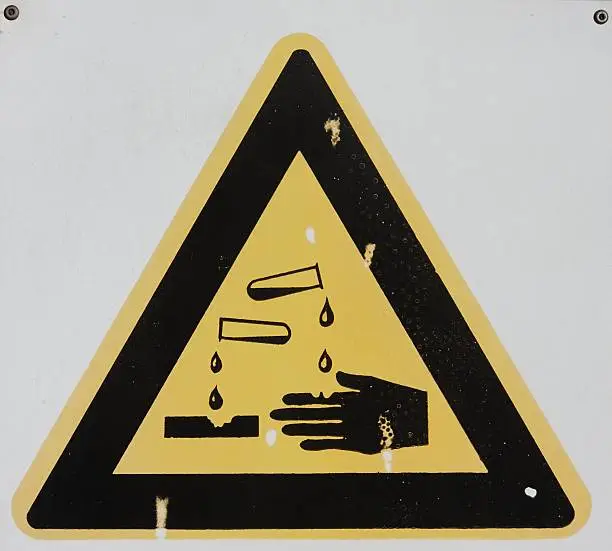 Photo of Dirty Danger Caustic Sign