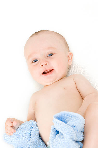 Smiling baby on white background stock photo