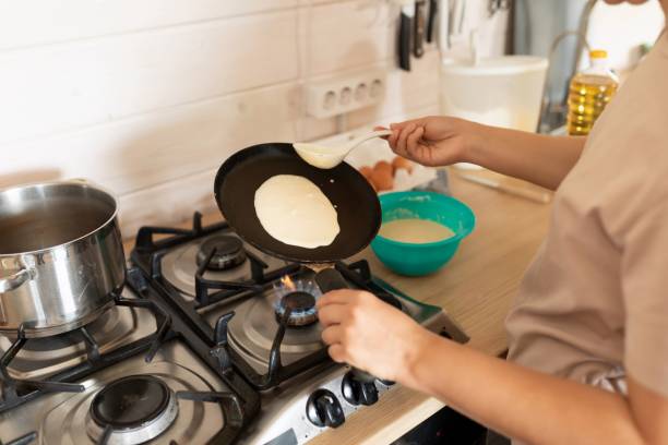 istock the process of making pancakes on a griddle in the home kitchen 1727986452