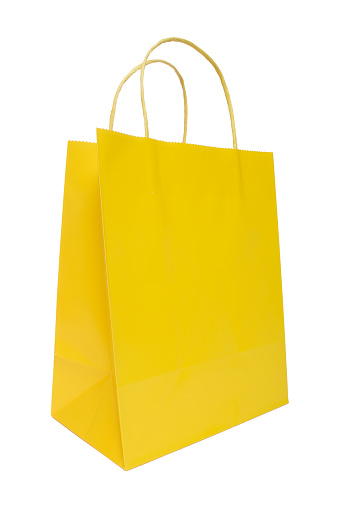 A yellow shopping bag set against a pure white background