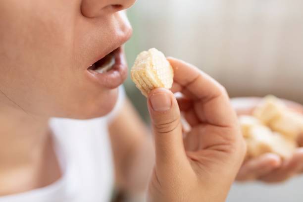 istock woman eating waffles for breakfast 1727993687