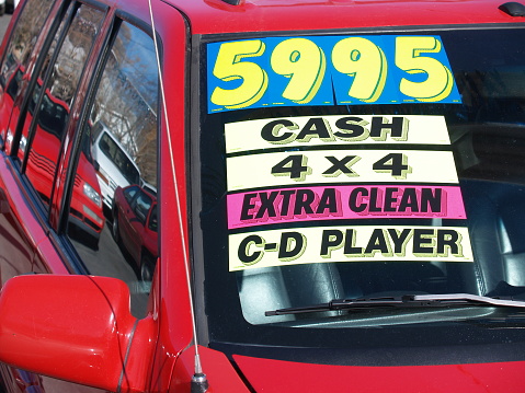 Used car with price tag sticker.