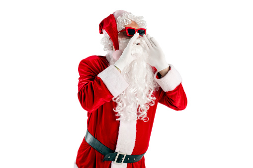 santa claus in red suit with beard in glasses shouts and announces the news on white isolated background, the concept of the new year and christmas